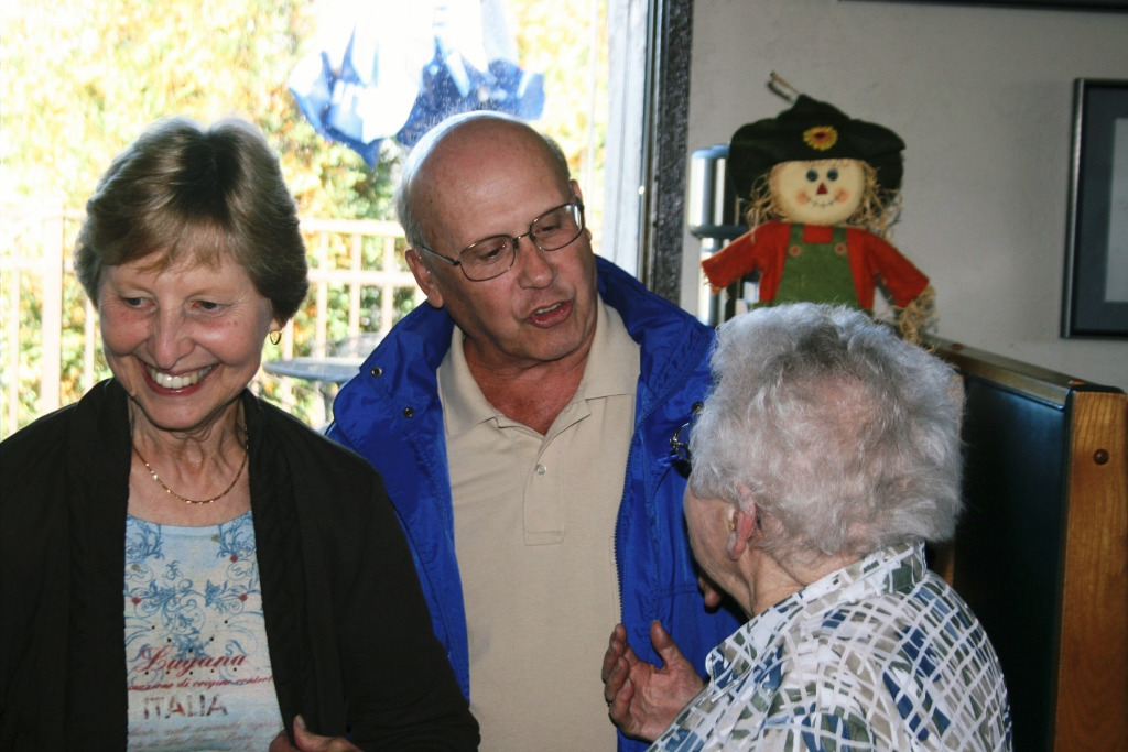 Henrietta talks with John/Betsy Blackmar.