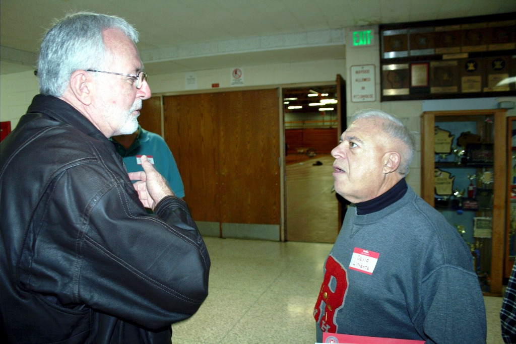 Mike Amos (l) chats with Dave Litrenta.