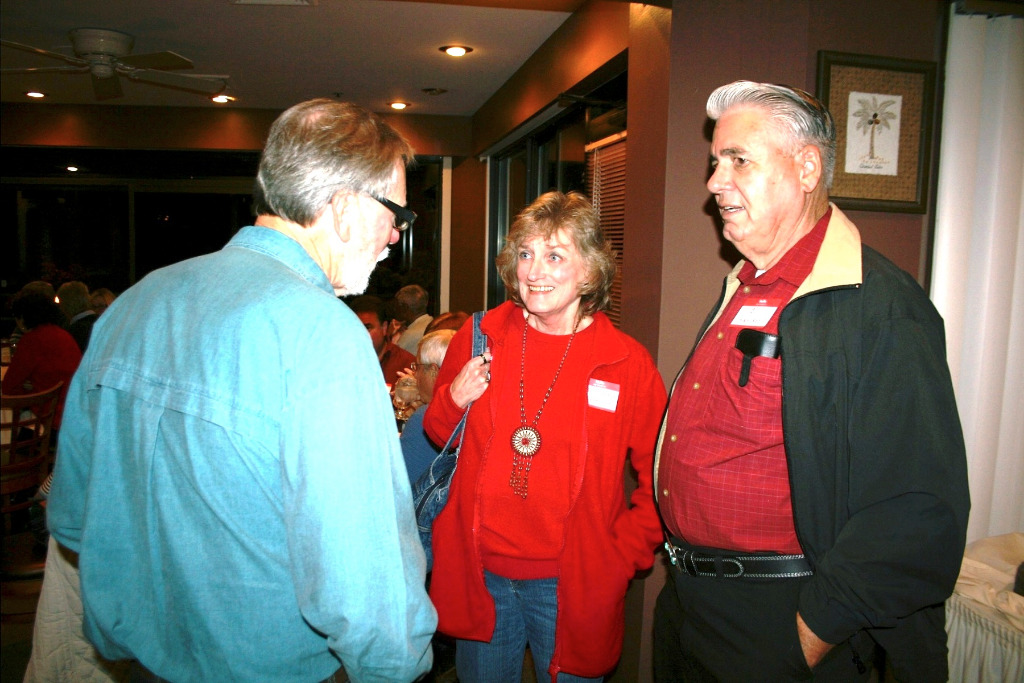 George Grauwels (Fairchild, WI) chats with Bill & Judy Nielsen Harrison (AZ)