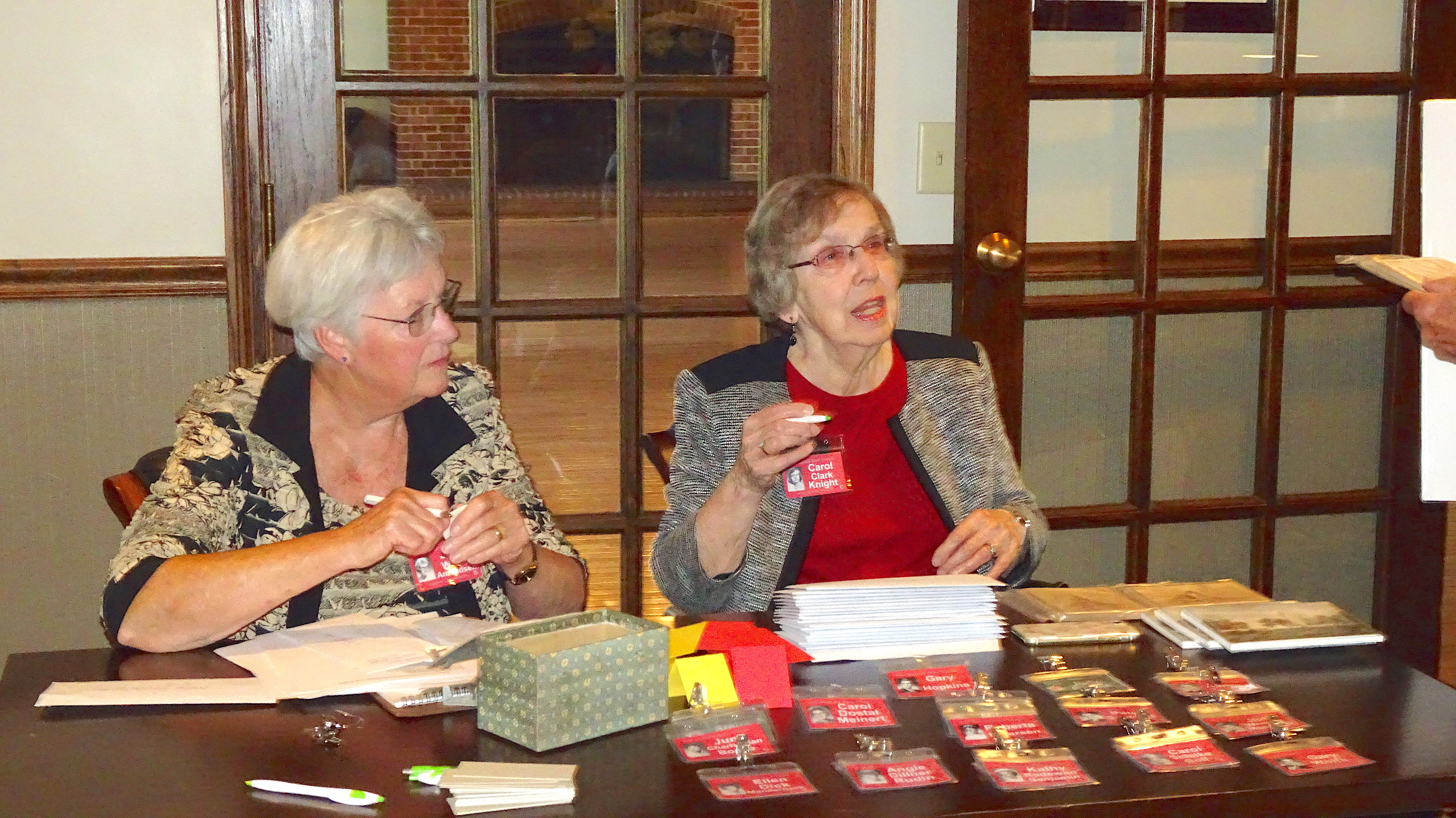 Judy Wilda and Carol Clark registering classmates