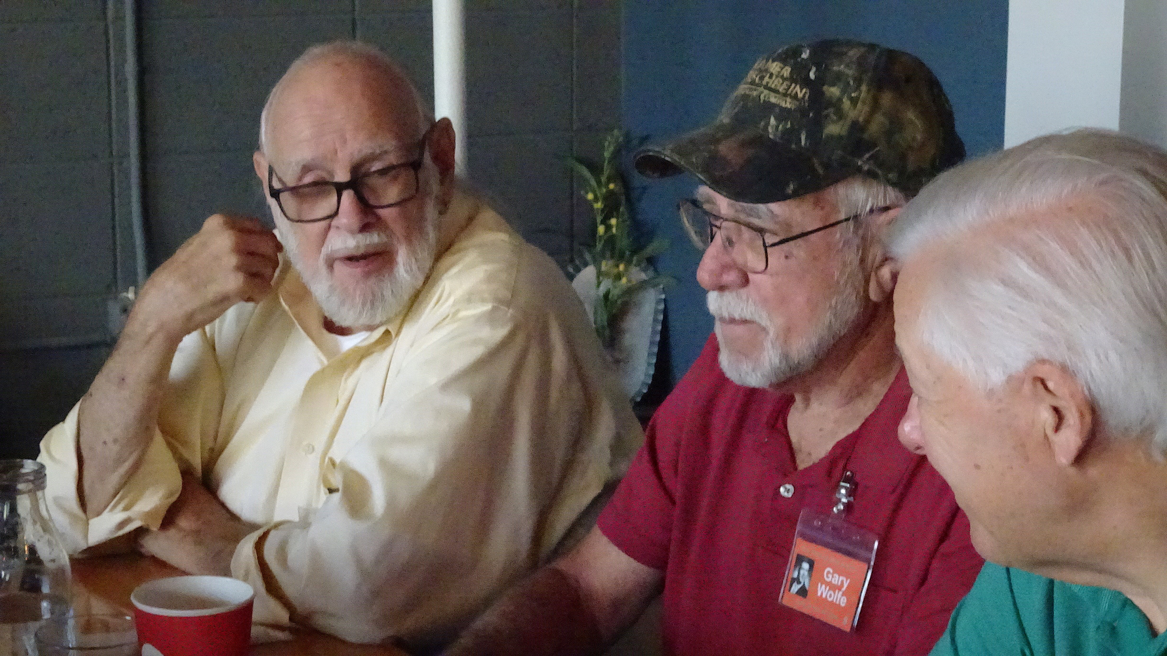 Dave Judd, Gary Wolfe and Bob Carter share old memories