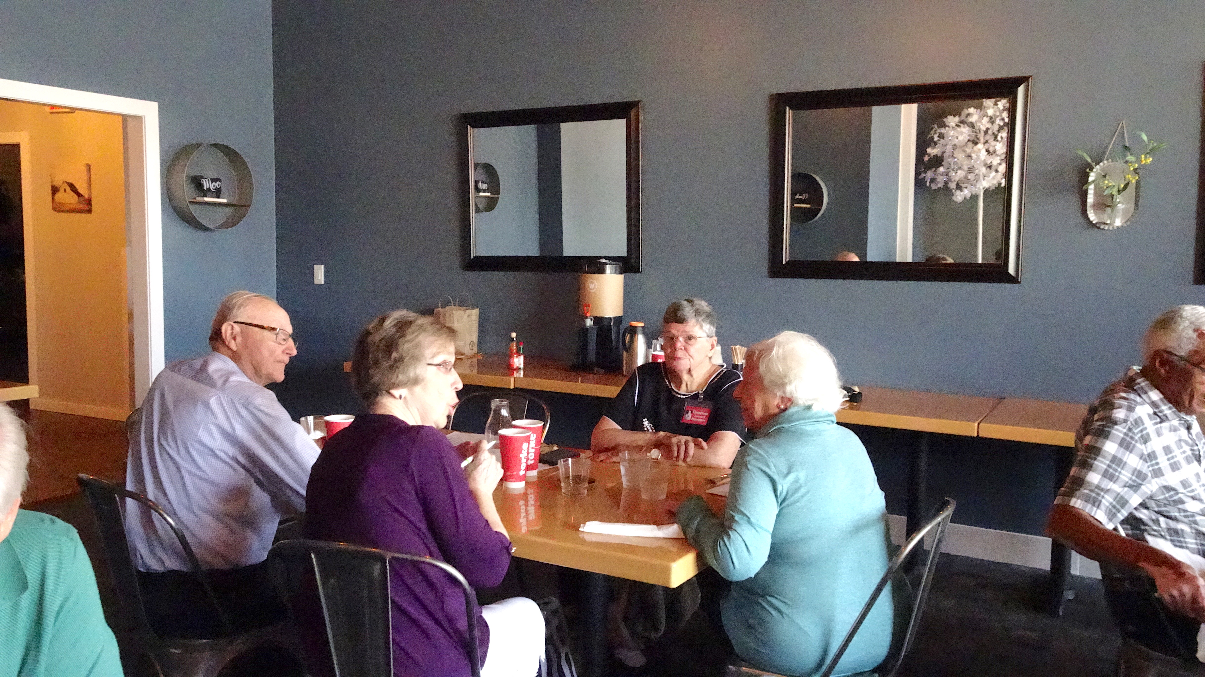 Mike and Carol Clark Knight talk with Gretchen Jensen and Barb Morgan White.